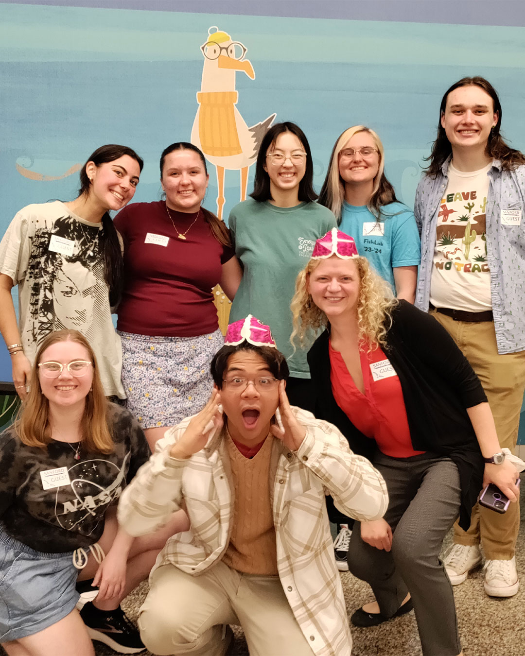 CNU's Nu Rho Psi chapter poses for a photo as they visit Sanford Elementary School.