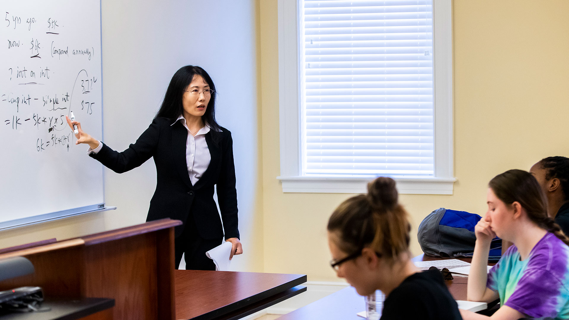 Professor Susan Ji teaching a business class