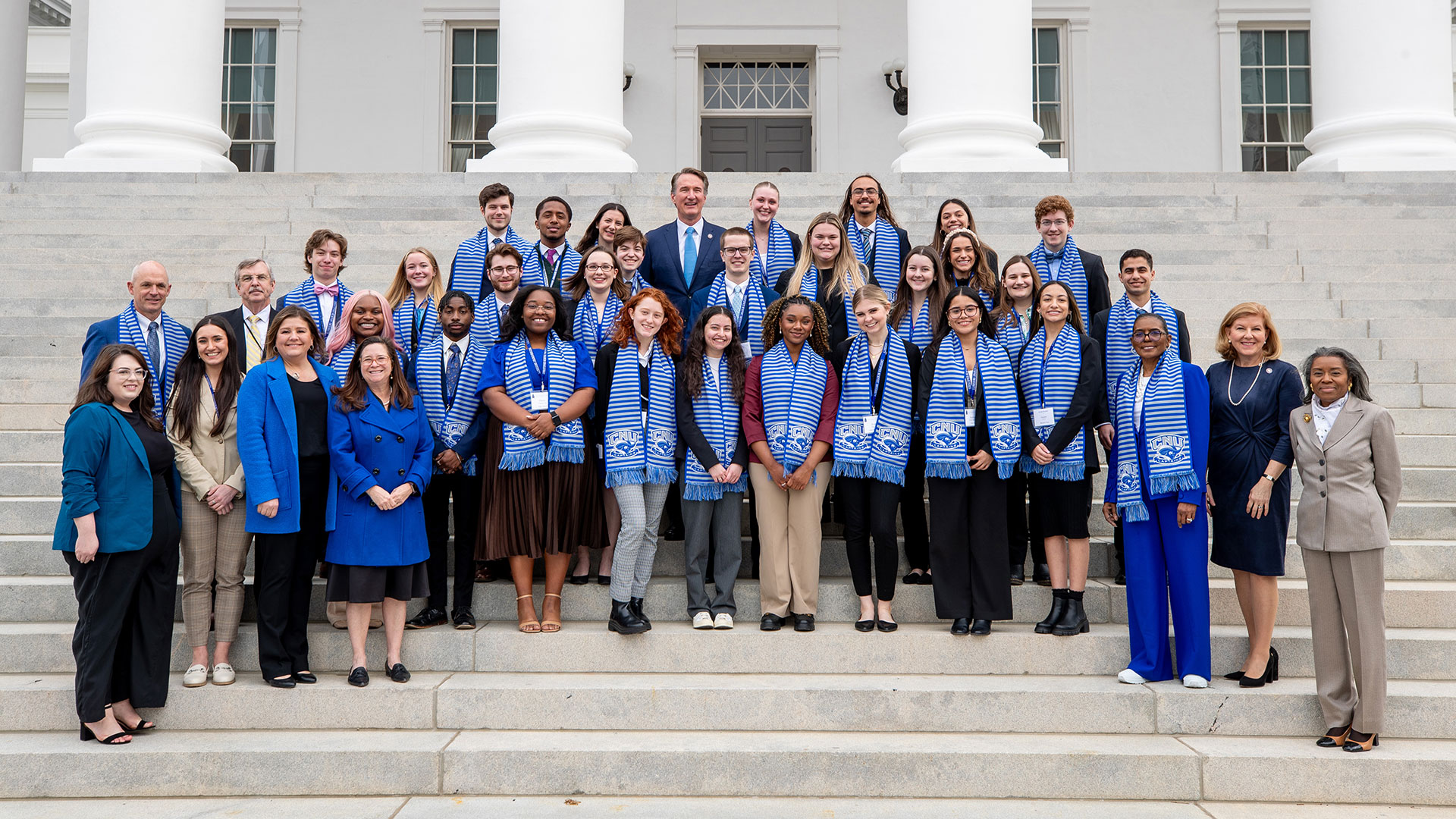 Captains visit the Virginia state capitol and pose for a picture with Governor Youngkin and Lieutenant Governor Earle-Sears