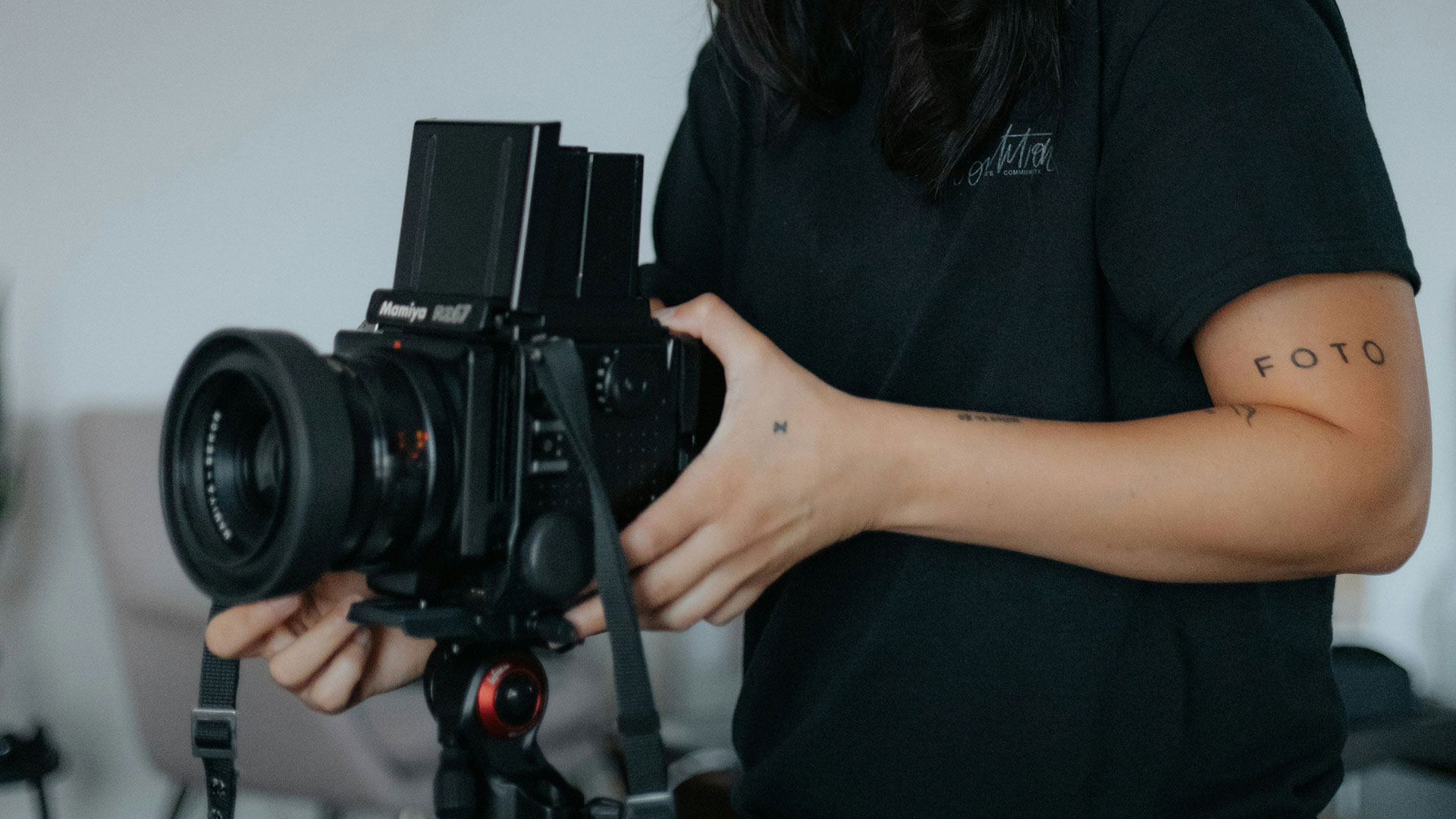 Hands holding a medium format camera